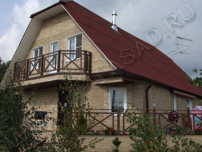 Дом из бревна кругляка, отделан фасадными панелями Nichiha, д. Апрелевка